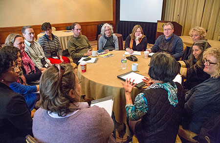 Photo of staff and council members from state arts agencies across the nation sitting in a circle