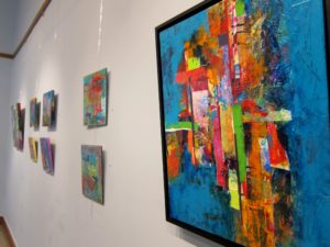 Soja Frey's exhibition in Delaware, view of paintings on a wall from a side angle